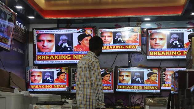 An Indian boy watches as television channels show news about International Court of Justice hearing the case of Indian naval officer Kulbhushan Jadhav at a shop in Jammu on May 15. (AP Photo) An Indian boy watches as television channels show news about International Court of Justice hearing the case of Indian naval officer Kulbhushan Jadhav at a shop in Jammu on May 15. (AP Photo)