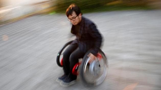Isao Uebayashi, 38, a sports science researcher and an inventor of ‘Slide Lift’, demonstrates with a motor-assisted wheelchair in Tokyo, Japan. Equipped with special wheels, the motor-assisted wheelchair can be moved by ‘Slide Lift’ racers in any direction, including in racing car-like drifts. E Technology can improve and supplement human ability,’ said Uebayashi. ‘ Anyone can do 'drift racing' with this wheelchair.’ (Kim Kyung-Hoon / Reuters)