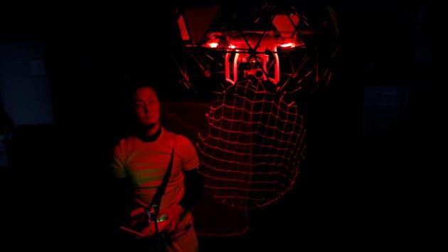Hirohiko Hayakawa, 26, a Ph.D. student in media design and an inventor of ‘ToriTori’, poses as he controls a drone in front of a goal net as he demonstrates the sport in Tokyo, Japan.Players controlling the small drones score a point by putting them in the goal net and opponent controlling the big drone acquires a point by capturing the small drone. Hayakawa said: ‘The drone in the air is a part of the player's body and this sport integrating human and machine makes me experience the feeling of flying.’ He said he was inspired by the bird catchers ("tori tori" in Japanese) in Kenji Miyazawa's classic 1934 fantasy novel ‘Night on the Galactic Railroad’. (Kim Kyung-Hoon / Reuters)