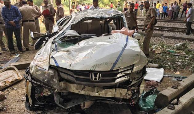 Three students were sitting in the front and four in the back seat of the Honda City car that toppled off a flyover in west Delhi’s Punjabi Bagh on Monday.(Ravi Choudhary/HT Photo)