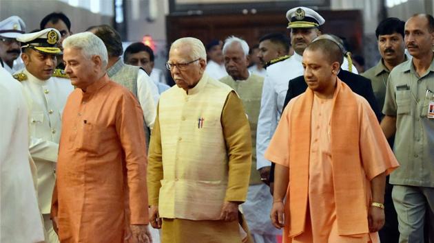 Governor Ram Naik with chief minister Yogi Adityanath and speaker Hriday Narayan Dikshit arrive to address the first sitting of the 17th Uttar Pradesh Assembly in Lucknow on Monday. (PTI) Governor Ram Naik with chief minister Yogi Adityanath and speaker Hriday Narayan Dikshit arrive to address the first sitting of the 17th Uttar Pradesh Assembly in Lucknow on Monday. (PTI)
