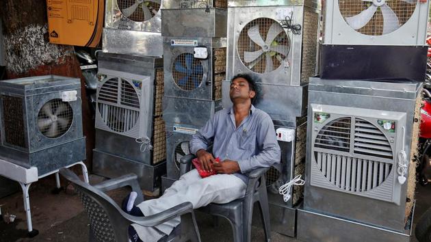 A man selling air coolers rests at a market on a hot summer day in Ahmedabad.(Reuters File Photo) A man selling air coolers rests at a market on a hot summer day in Ahmedabad.(Reuters File Photo)