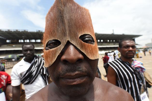 A man wearing a mask made from animal skin from Benue State in northcentral Nigeria performs during a carnival . (PIUS UTOMI EKPEI / AFP)