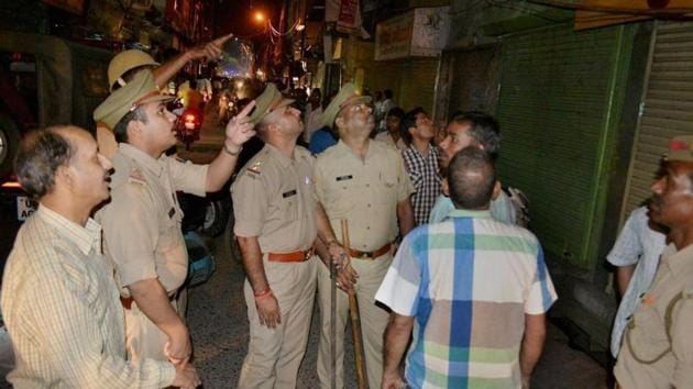 Police inspect the jewellery shop after it was attacked by robbers in Mathura. (PTI) Police inspect the jewellery shop after it was attacked by robbers in Mathura. (PTI)