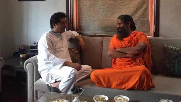 MNS chief Raj Thackeray with yoga guru Ramdev on Wednesday.(HT)