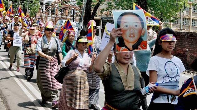 Exiled Tibetans protest during a protest march demanding the release of their religious leader Gedhun Choekyi Nyima who was the world’s youngest political prisoner, abducted by Chinese authorities. (PTI)