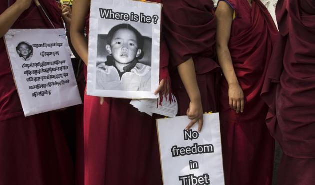 Buddhist nuns carry placards during a protest march demanding the release of religious leader Gedhun Choekyi Nyima, the 11th Panchen Lama, who was put under house arrest by the Chinese authorities on this day in 1995. Panchen Lama is the second most important religious leader in Tibetan Buddhism, after the Dalai Lama. The Dalai Lama was involved in recognizing the Panchen Lama, and in turn the Panchen Lama is also historically part of the process by which each new Dalai Lama is chosen. (Ashwini Bhatia/AP)