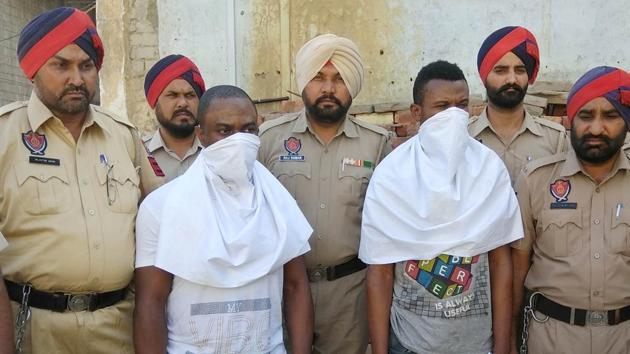 The arrested men in Punjab police custody in Jagraon on Wednesday, May 17. (Gurminder Singh /HT) The arrested men in Punjab police custody in Jagraon on Wednesday, May 17. (Gurminder Singh /HT)