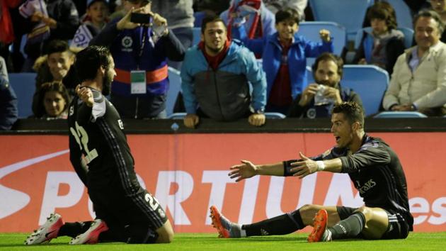 Real Madrid’s Cristiano Ronaldo celebrates with Isco after scoring their second goal against Celta Vigo in La Liga.(REUTERS)