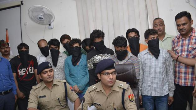 A gang of 10 was arrested by the Ghaziabad police for duping customers on the pretext of solving their personal problems. (Sakib Ali /HT Photo) A gang of 10 was arrested by the Ghaziabad police for duping customers on the pretext of solving their personal problems. (Sakib Ali /HT Photo)