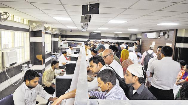 Despite the huge crowd at the land deed registration office when it opened on Thursday, officials said only 100 registrations would be executed, on a first-come-first-serve basis. (Parveen Kumar/HT Photo) Despite the huge crowd at the land deed registration office when it opened on Thursday, officials said only 100 registrations would be executed, on a first-come-first-serve basis. (Parveen Kumar/HT Photo)