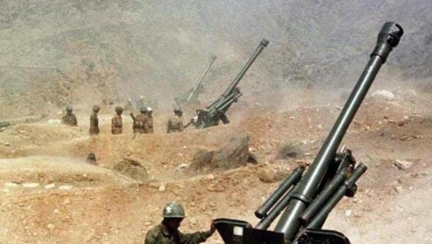 Soldiers from the Indian army fire their 105mm guns, 31 May 1999, from their outpost near Kargil towards the India-Pakistan border in Kashmir. Kargil was a classic limited war initiated by Pakistan. India also restricted its aim to restoration of status quo and won a victory both militarily and diplomatically.(AFP)