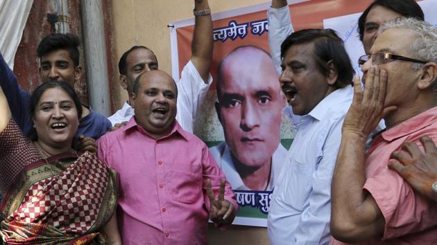 Friends of former Indian naval officer Kulbhushan Jadhav celebrate the International Court of Justice order on Thursday.(AP Photo) Friends of former Indian naval officer Kulbhushan Jadhav celebrate the International Court of Justice order on Thursday.(AP Photo)