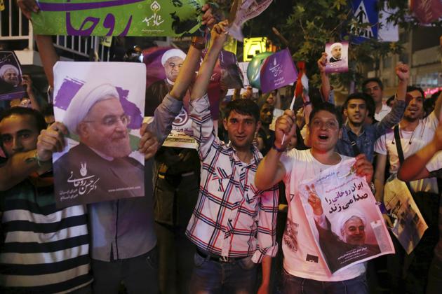 Supporters of Iranian President Hassan Rouhani during a street campaign in Tehran. (AP) Supporters of Iranian President Hassan Rouhani during a street campaign in Tehran. (AP)
