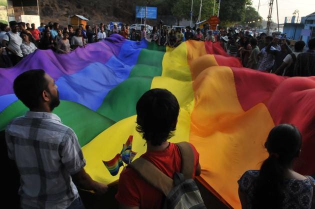 LGBT community member along with supports waving Rainbow flag during central India`s first pride parade taken out to mark the International day against Homophobia and Transphobia in Bhopal. (Mujeeb Faruqui/HT Photo) LGBT community member along with supports waving Rainbow flag during central India`s first pride parade taken out to mark the International day against Homophobia and Transphobia in Bhopal. (Mujeeb Faruqui/HT Photo)