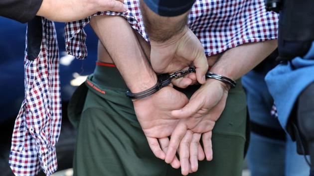 US Immigration and Customs Enforcement (ICE) officers arrest an Iranian immigrant in San Clemente, California on May 11. (REUTERS) US Immigration and Customs Enforcement (ICE) officers arrest an Iranian immigrant in San Clemente, California on May 11. (REUTERS)