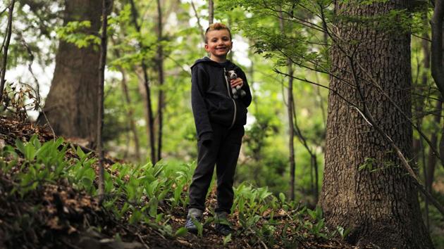 Seven-year-old transgender boy Jacob Lemay poses for photos in the yard of his home in Melrose, Massachusetts. (JEWEL SAMAD / AFP)