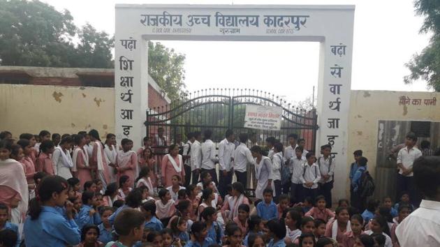Around 8 am on Friday morning, over 250 students locked the gate and sat in front of the school demanding upgradation of their school from class X to XII. (HT Photo) Around 8 am on Friday morning, over 250 students locked the gate and sat in front of the school demanding upgradation of their school from class X to XII. (HT Photo)