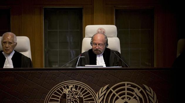 Presiding judge Ronny Abraham of France reads the World Court's verdict in the case brought by India against Pakistan in The Hague, Netherlands on May 18.(AP Photo)