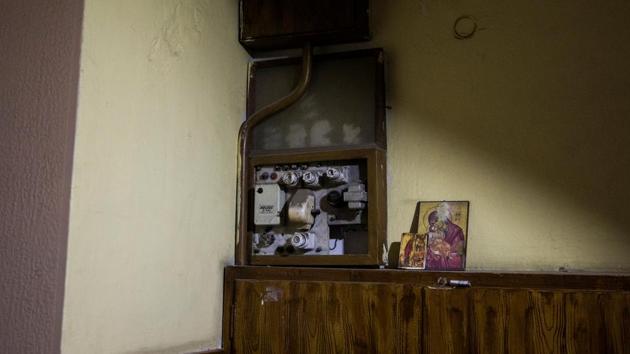 An old electrical distribution panel is seen along with holy portraits placed at the entrance of the apartment building where the Argyros family lives in Athens. (Alkis Konstantinidis/REUTERS ) An old electrical distribution panel is seen along with holy portraits placed at the entrance of the apartment building where the Argyros family lives in Athens. (Alkis Konstantinidis/REUTERS )