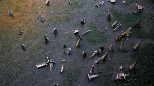 Discarded traffic cones part of waste lying on the banks of the River Thames during low tide. His photographs are both mundane and yet enigmatic. (Stefan Wermuth/Reuters) Discarded traffic cones part of waste lying on the banks of the River Thames during low tide. His photographs are both mundane and yet enigmatic. (Stefan Wermuth/Reuters)