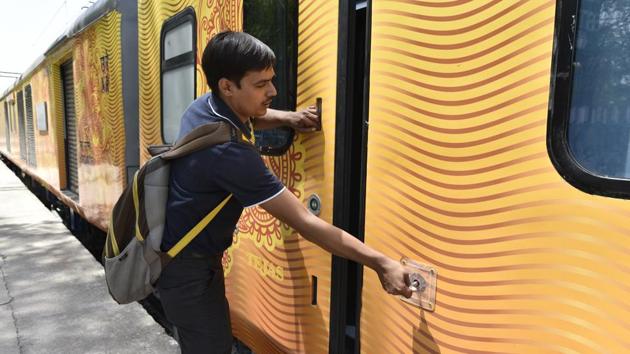 An operator keys in an automatic entrance plug door in the Tejas Express. (Arvind Yadav/HT PHOTO) An operator keys in an automatic entrance plug door in the Tejas Express. (Arvind Yadav/HT PHOTO)