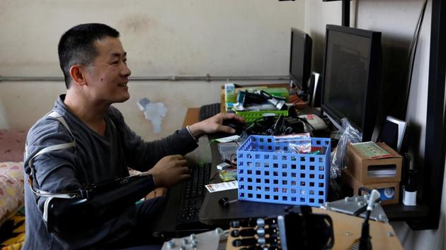 An engineer, Chang draws a design for a 3D-print model for a prosthetic hand in Taiwan. Chang’s arm was amputed after an accident. Dissatisfied with the amputation, he decided to learn 3D printing technology by himself. (Tyrone Siu /REUTERS)