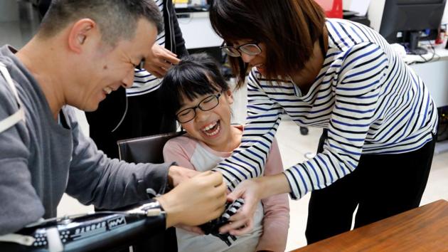 After multiple attempts,Chang was finally able to design an 3D printed prosthetic arm which cost roughly 53,000 rupees. A commercially made prosthetic typically costs more than 3 lakh rupees. (Tyrone Siu /REUTERS)