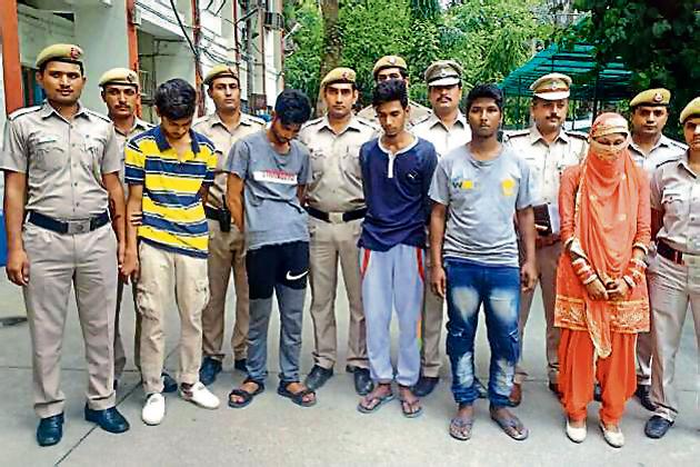 The gang in police custody. The gang in police custody.