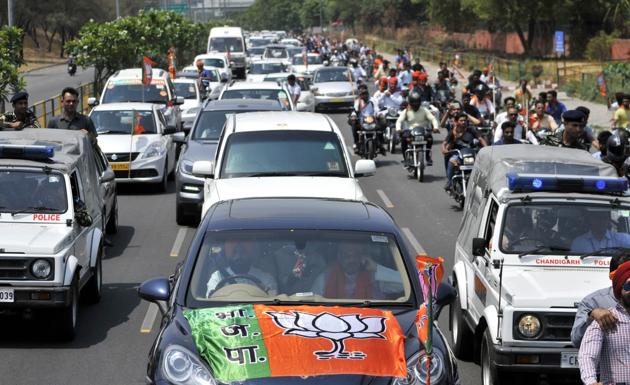 The BJP chief during a roadshow in Chandigarh. (Ravi Kumar/HT Photo)