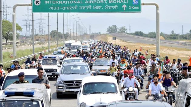 Shah was escorted to BJP office by a cavalcade of 200 vehicles. (Ravi Kumar/HT Photo)