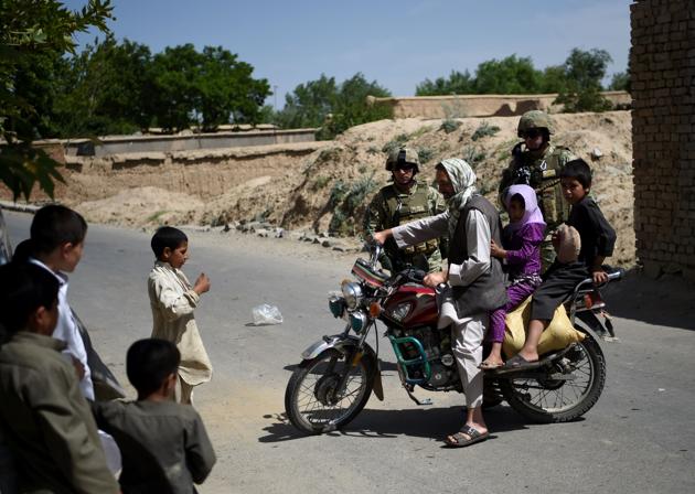 An Afghan motorcyclist turns his bike near the site of a roadside bomb blast at Abed Kheel near Charikar district of Parwan province.(AFP File Photo) An Afghan motorcyclist turns his bike near the site of a roadside bomb blast at Abed Kheel near Charikar district of Parwan province.(AFP File Photo)
