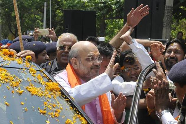 BJP chief Amit Shah during a road show in Chandigarh on Saturday.(Karun Sharma/HT)