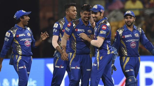Mumbai Indians’ Karn Sharma (R) celebrates a Kolkata Knight Riders wicket with teammates during their 2017 Indian Premier League (IPL) second qualifier match at the M. Chinnaswamy Stadium in Bangalore on Friday.(AP)