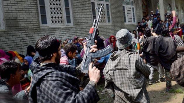 Suspected militants brandish their guns and shout slogans during the funeral of a slain comrade, killed in a shoot out with the police, at Qoimoh in Kulgam district of south Kashmir on May 7.(PTI File Photo) Suspected militants brandish their guns and shout slogans during the funeral of a slain comrade, killed in a shoot out with the police, at Qoimoh in Kulgam district of south Kashmir on May 7.(PTI File Photo)
