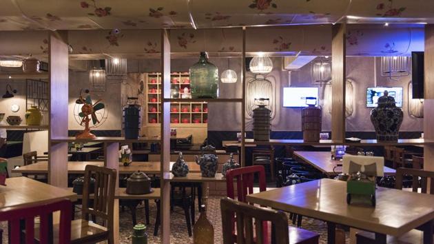 The decor at Desi Culture in Lower Parel is playful — brick and Mangalore tile on one wall, Chinese-style etching on another. A tiny wooden dumper truck holding tissues and cutlery on each table. Some of the cocktails are served in a quarter bottle. (Aalok Soni / HT Photo)