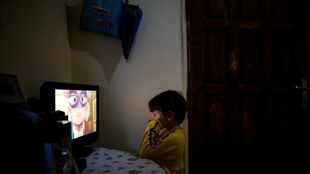 Panagiotis Argyros watches cartoons on television at his house . It is estimated that a quarter of Greece’s workforce is unemployed and nearly a one third of the population lives in poverty (Alkis Konstantinidis/REUTERS ) Panagiotis Argyros watches cartoons on television at his house . It is estimated that a quarter of Greece’s workforce is unemployed and nearly a one third of the population lives in poverty (Alkis Konstantinidis/REUTERS )