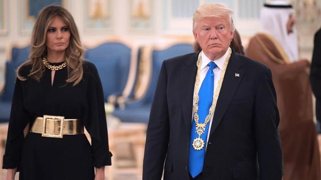 US President Donald Trump and First Lady Melania Trump make their way to a luncheon after Trump received the Order of Abdulaziz al-Saud medal from Saudi Arabia's King Salman bin Abdulaziz al-Saud at the Saudi Royal Court in Riyadh on May 20, 2017. (AFP Photo) US President Donald Trump and First Lady Melania Trump make their way to a luncheon after Trump received the Order of Abdulaziz al-Saud medal from Saudi Arabia's King Salman bin Abdulaziz al-Saud at the Saudi Royal Court in Riyadh on May 20, 2017. (AFP Photo)