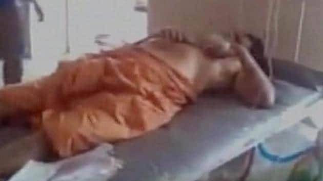 Ganeshananda Theerthapada alias Srihari lies on a hospital bed after two surgeries. A 23-year-old woman had gashed his genitals for sexually exploiting her for years.(ANI)