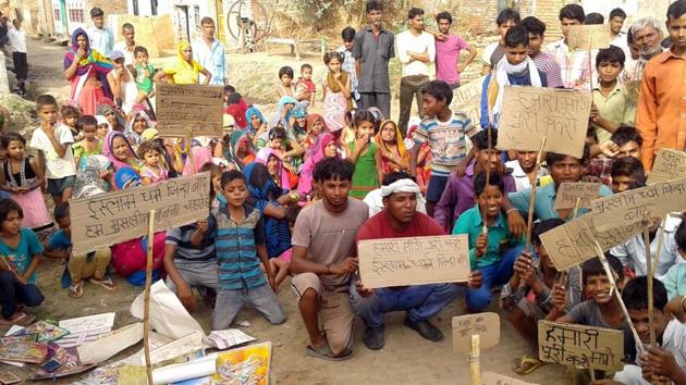 Over 40 Dalit families of Keshopur-Jafri village in UP immersed idols of Hindu deities and threatened to convert to Islam to protest ‘biased’ police action after caste clashes with Thakurs. (Mahipal Singh /HT Photo) Over 40 Dalit families of Keshopur-Jafri village in UP immersed idols of Hindu deities and threatened to convert to Islam to protest ‘biased’ police action after caste clashes with Thakurs. (Mahipal Singh /HT Photo)