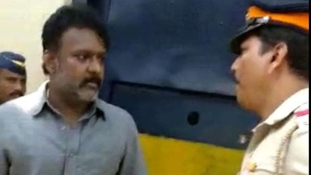 A video grab showing former MLA from Solapur, Ramesh Kadam arguing with assistant police inspector Manoj Pawar outside Byculla jail. A video grab showing former MLA from Solapur, Ramesh Kadam arguing with assistant police inspector Manoj Pawar outside Byculla jail.