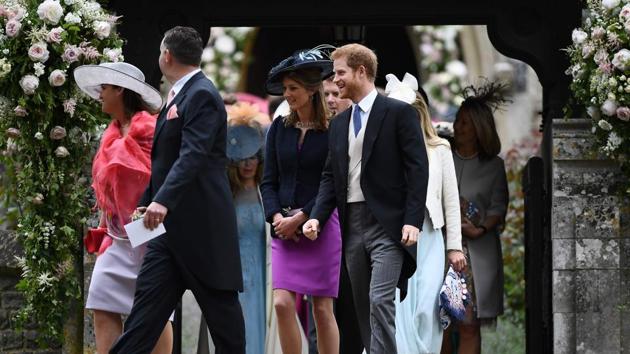 Britain's Prince Harry (R) leaves St Mark's Church in Englefield, west of London. (Justin TALLIS / AFP) 