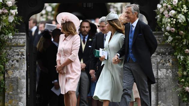 Carole Middleton (L), and her husband Michael Middleton (3R) at St Mark's Church in Englefield. (Justin TALLIS / AFP) 