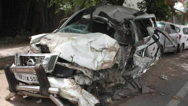 The SUV hit a vegetable cart and a road divider, toppled and skidded for nearly 100 metres on Najafgarh-Bahadurgarh road. (HT Photo) The SUV hit a vegetable cart and a road divider, toppled and skidded for nearly 100 metres on Najafgarh-Bahadurgarh road. (HT Photo)