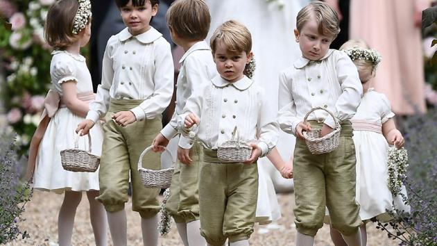 Britain's prince George (front row C), a pageboy, reacts following the wedding of his aunt Pippa Middleton. (Justin TALLIS / AFP) 