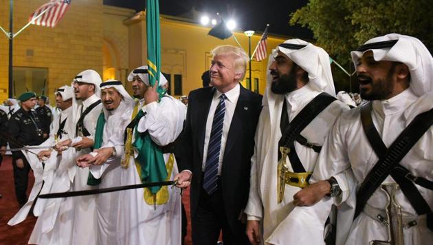US President Donald Trump joins dancers with swords at a welcome ceremony ahead of a banquet at the Murabba Palace in Riyadh. (MANDEL NGAN / AFP)