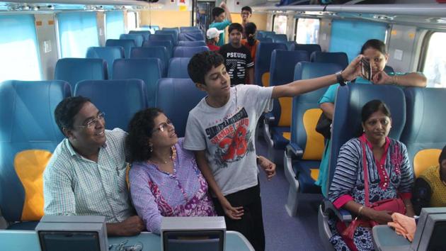 A family hops on to the train for its first-ever ride. (Bhushan Koyande/ HT PHOTO) 