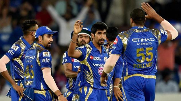 Mumbai Indians Jasprit Bumrah with team mates celebrates the wicket of Rahul Tripathi. (PTI)