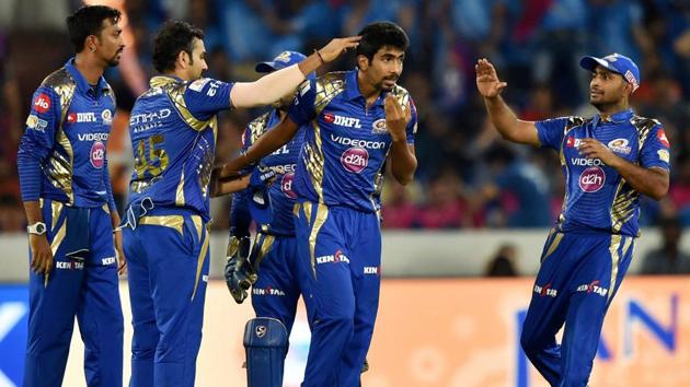 Mumbai Indians Jasprit Bumrah with team mates celebrate the wicket of MS Dhoni. (PTI)