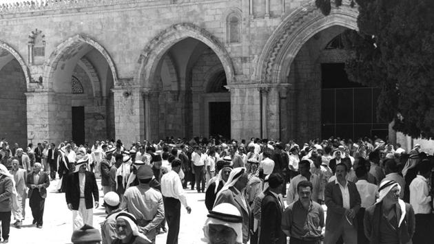BEFORE:People stand in a plaza near al-Aqsa mosque during Friday prayers on the compound known to Muslims as Noble Sanctuary and to Jews as Temple Mount. (REUTERS)